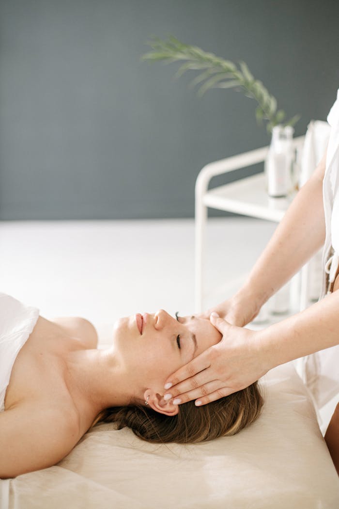 gallery-2 Calm and rejuvenating head massage therapy session with a relaxing ambiance.